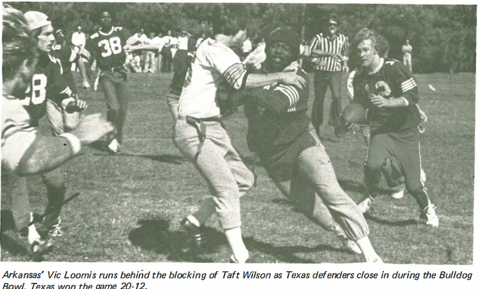 Arkansas' Vic Loomis runs behind the blocking of Taft Wilson as Texas defenders close in during the Bulldog Bowl.  Texas won the game 20-12.